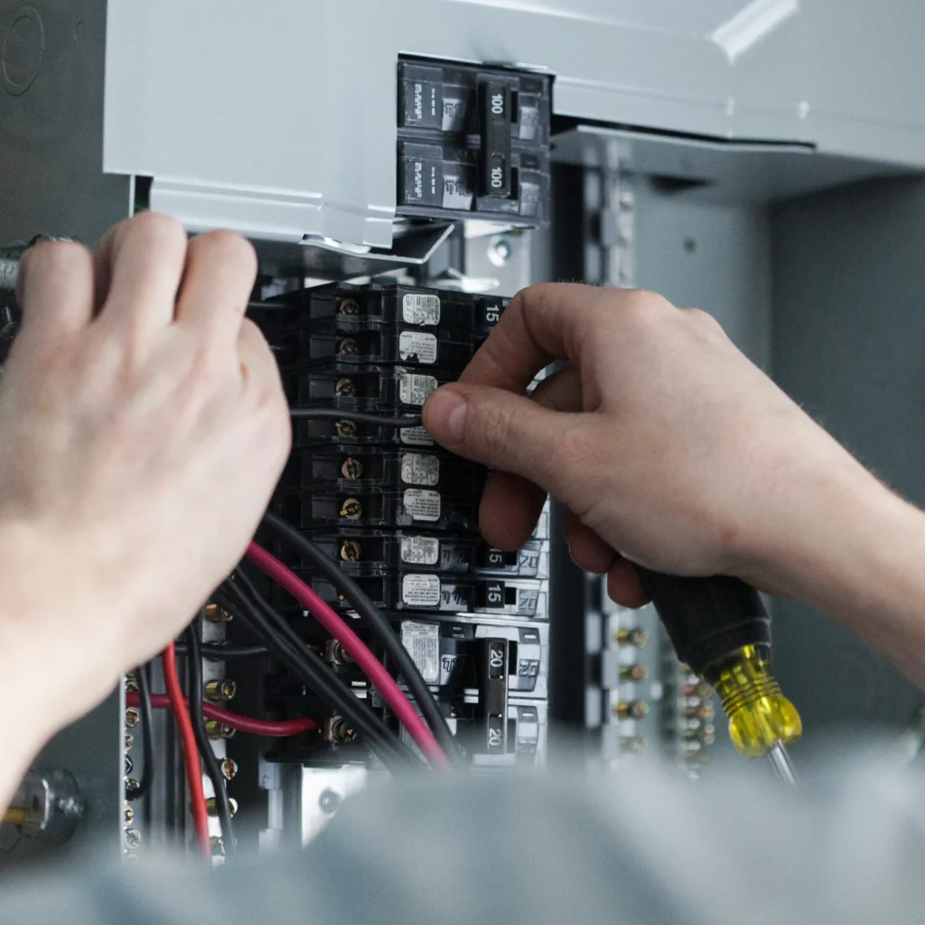 Electrician replacing the distribution board to upgrade a homes electrical panel.