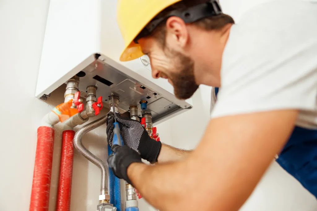 plumber installing water heater in Crawfordsville, IN